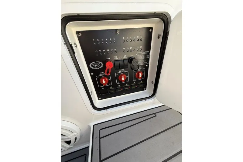Slide: The Image of Control panel of a 2019 Cobalt A36 boat with switches and dials. - 27