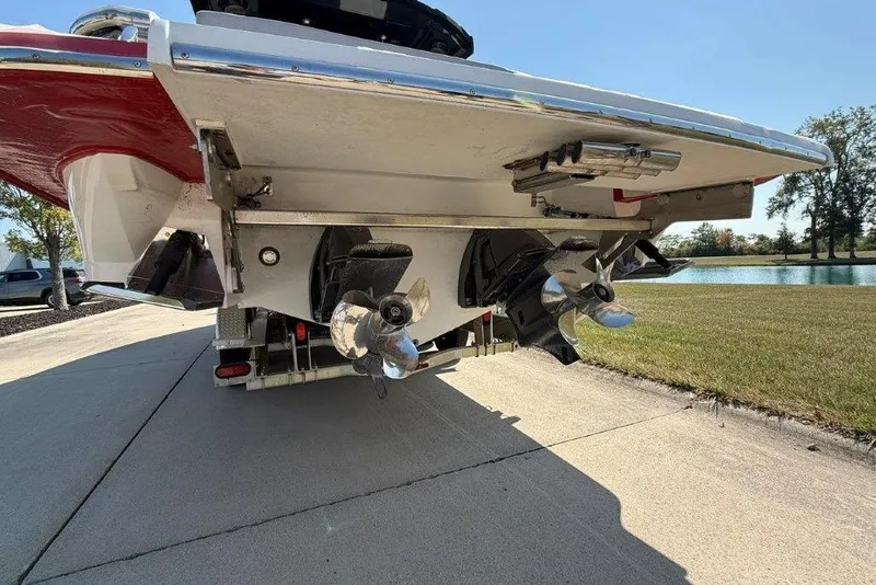 Slide: The Image of 2019 Cobalt A36 boat stern with dual propellers on a sunny day. - 29