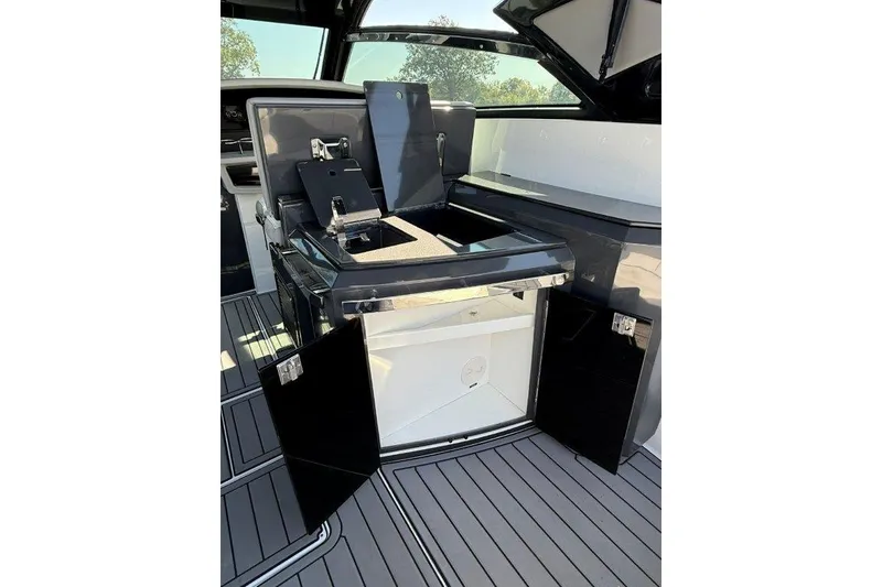 Slide: The Image of 2019 Cobalt A36 boat interior with sleek black cabinetry and modern design. - 30