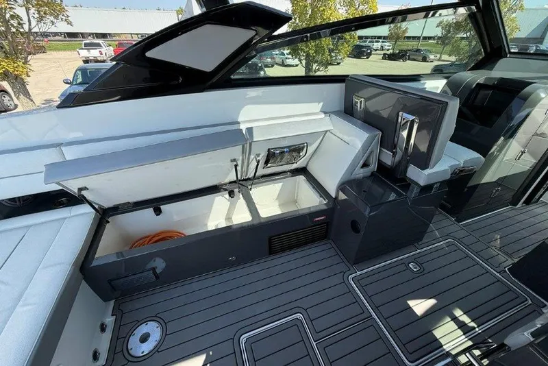 Slide: The Image of 2019 Cobalt A36 boat interior with open storage compartments and sleek seating. - 33