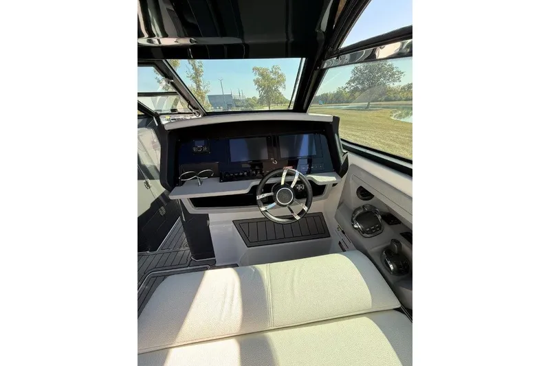 Slide: The Image of Interior of 2019 Cobalt A36 boat with modern helm and steering wheel. - 34