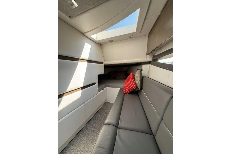 Slide: The Image of Luxurious interior of 2019 Cobalt A36 boat with skylight and modern seating. - 41