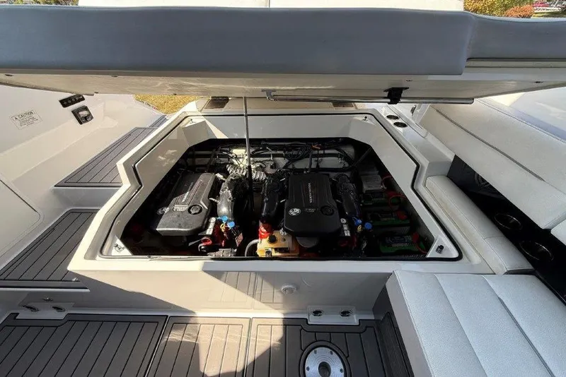 Slide: The Image of Open engine compartment of a 2019 Cobalt A36 boat, showcasing detailed engine components. - 42