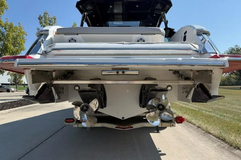 Slide: The Image of Rear view of a 2019 Cobalt A36 boat with dual propellers on a sunny day. - 45
