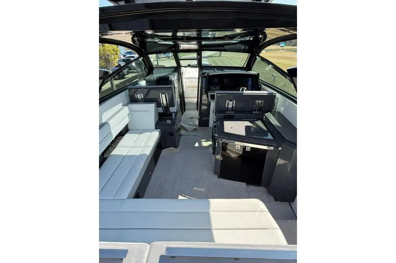 Slide: The Image of Interior of a 2019 Cobalt A36 boat with modern seating and sleek design. - 46