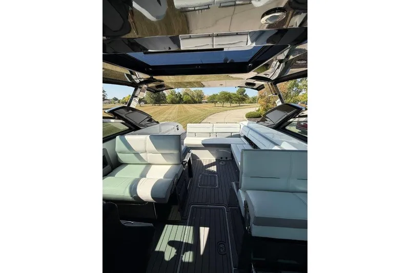 Slide: The Image of Interior of a 2019 Cobalt A36 boat with luxurious seating and open sunroof. - 51