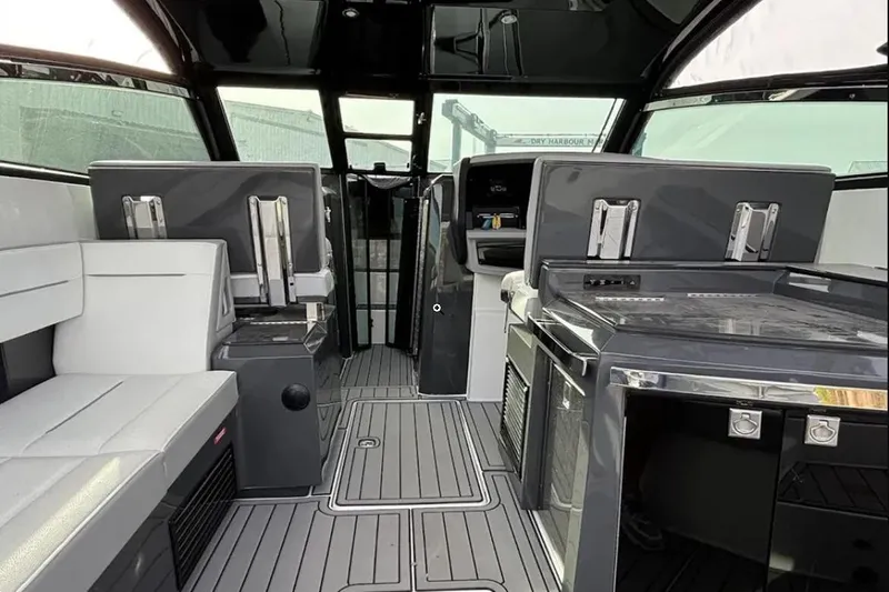 Slide: The Image of Interior of a 2019 Cobalt A36 boat with modern seating and sleek design. - 6