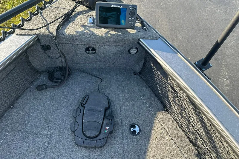 Slide: The Image of 2016 Lund 1775 Pro-V SS boat interior with Lowrance fish finder and foot pedal. - 13
