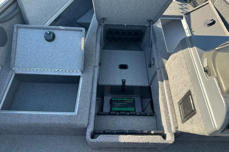 Slide: The Image of 2016 Lund 1775 Pro-V SS boat interior storage compartments and battery area. - 15