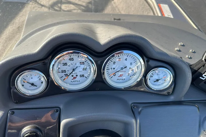 Slide: The Image of Dashboard of 2016 Lund 1775 Pro-V SS boat with speedometer and fuel gauges. - 19