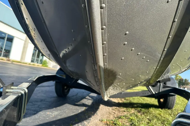 Slide: The Image of 2016 Lund 1775 Pro-V SS boat hull on trailer, close-up view. - 28