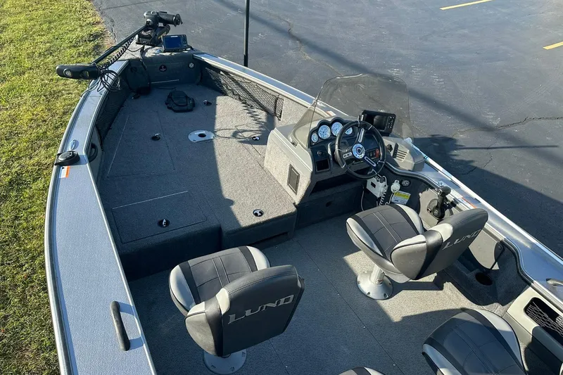 Slide: The Image of 2016 Lund 1775 Pro-V SS fishing boat interior with steering console and seating. - 8