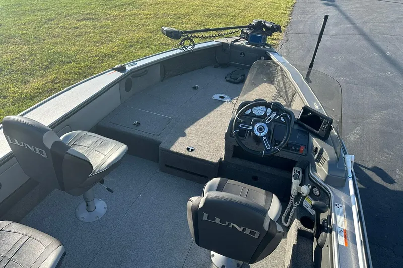 Slide: The Image of 2016 Lund 1775 Pro-V SS boat interior with steering wheel and seating. - 9