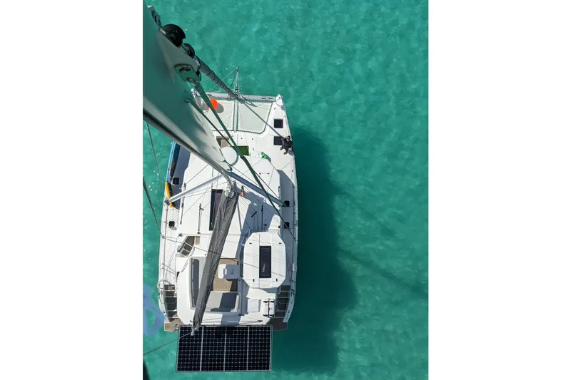 Slide: The Image of Aerial view of 2023 Leopard 42 catamaran on clear turquoise water. - 17