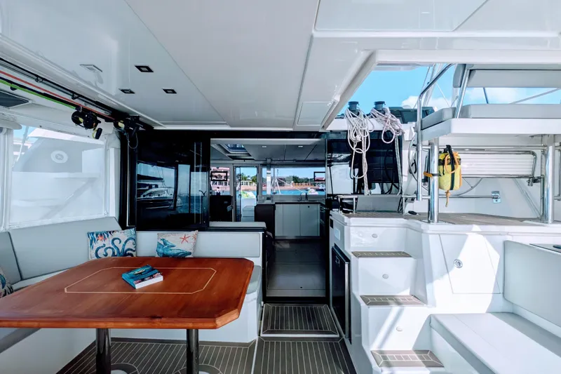Slide: The Image of Luxurious interior of 2023 Leopard 42 catamaran with modern seating and dining area. - 26