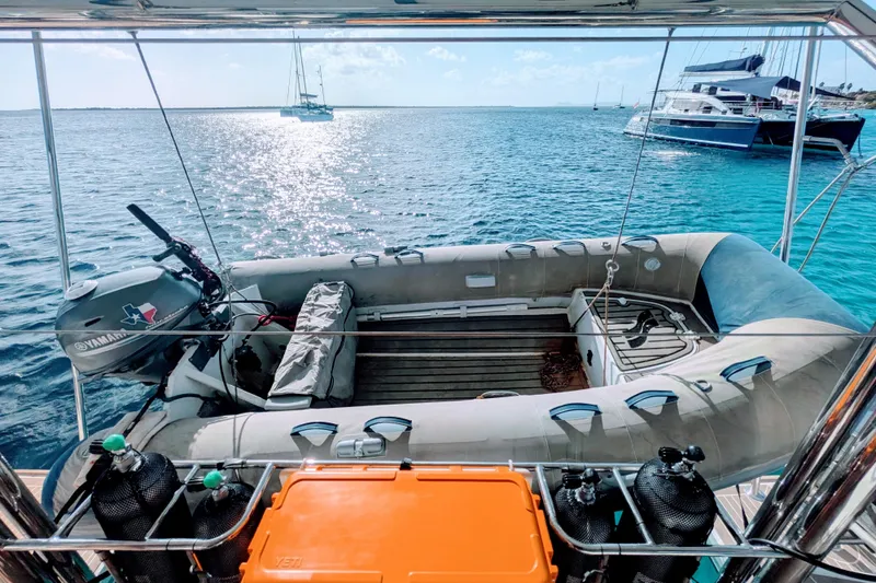 Slide: The Image of Leopard 42 yacht with inflatable dinghy and Yamaha motor on clear blue water, 2023 model. - 33