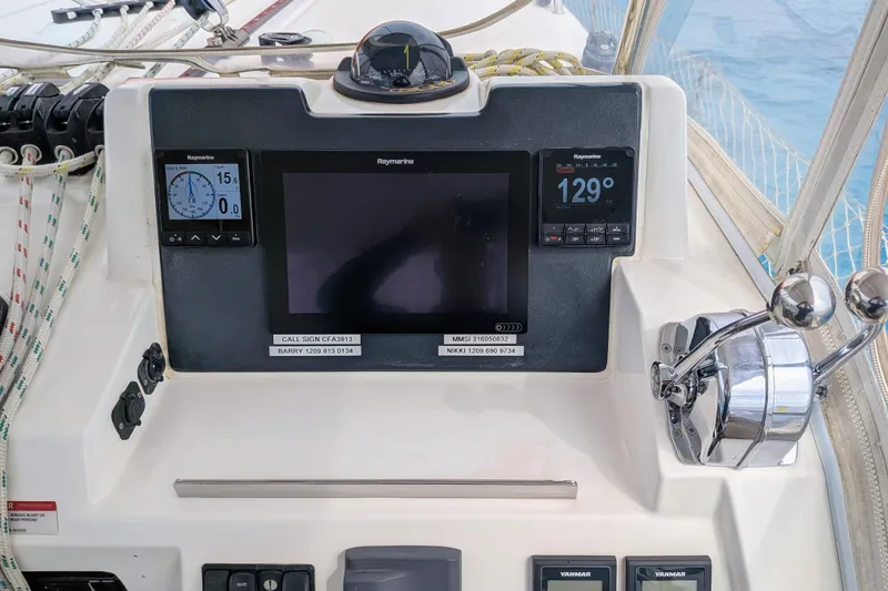Slide: The Image of Control panel of a 2023 Leopard 42 yacht with navigation instruments and throttle controls. - 39