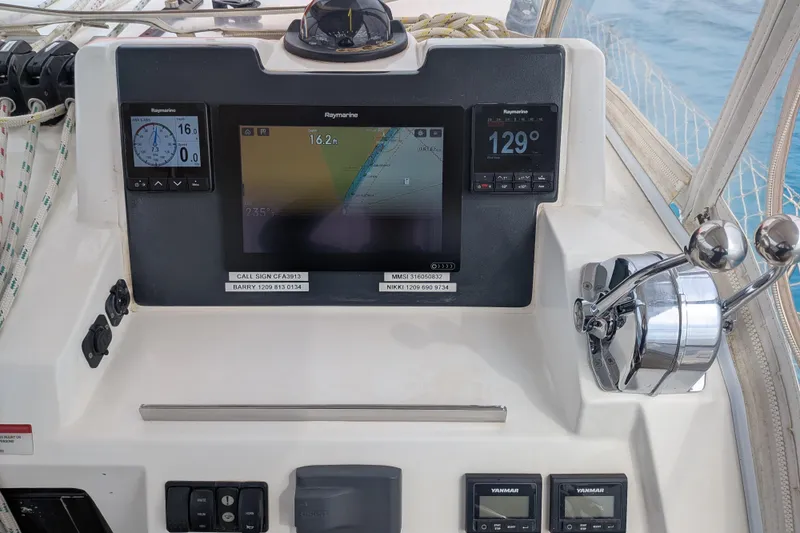 Slide: The Image of Control panel of a 2023 Leopard 42 yacht with navigation displays and throttle controls. - 40