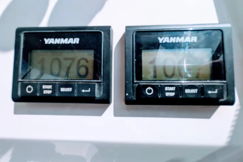 Slide: The Image of Yanmar engine hour meters displaying 1076 and 1067 hours on Leopard 42, 2023 model. - 41