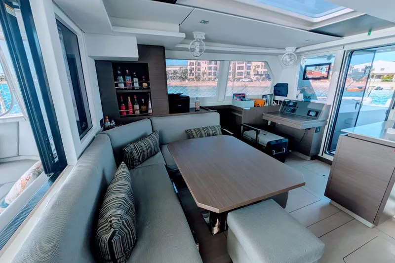 Slide: The Image of Luxurious interior of 2023 Leopard 42 yacht with modern seating and bar area. - 44