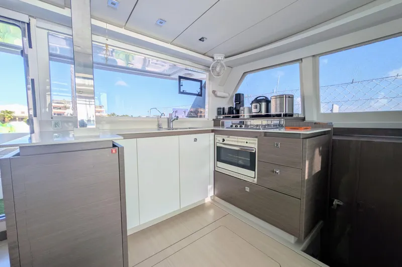 Slide: The Image of Modern kitchen interior on 2023 Leopard 42 yacht, featuring sleek appliances and ample natural light. - 50