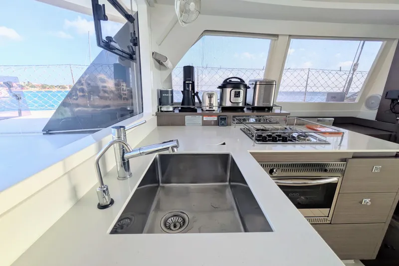 Slide: The Image of Modern kitchen in 2023 Leopard 42 yacht with appliances and ocean view. - 51