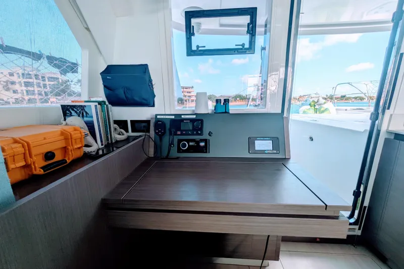 Slide: The Image of 2023 Leopard 42 yacht interior with navigation station and outdoor view. - 53