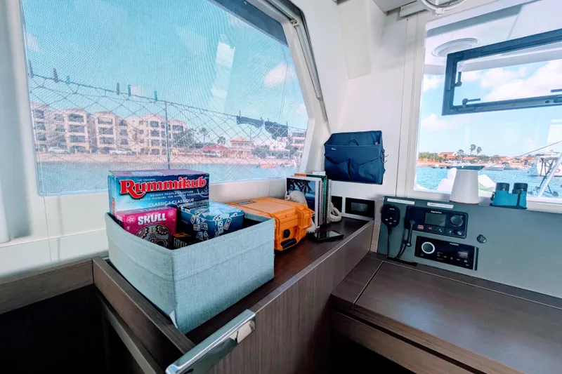Slide: The Image of Interior of 2023 Leopard 42 yacht with games and equipment by window. - 55