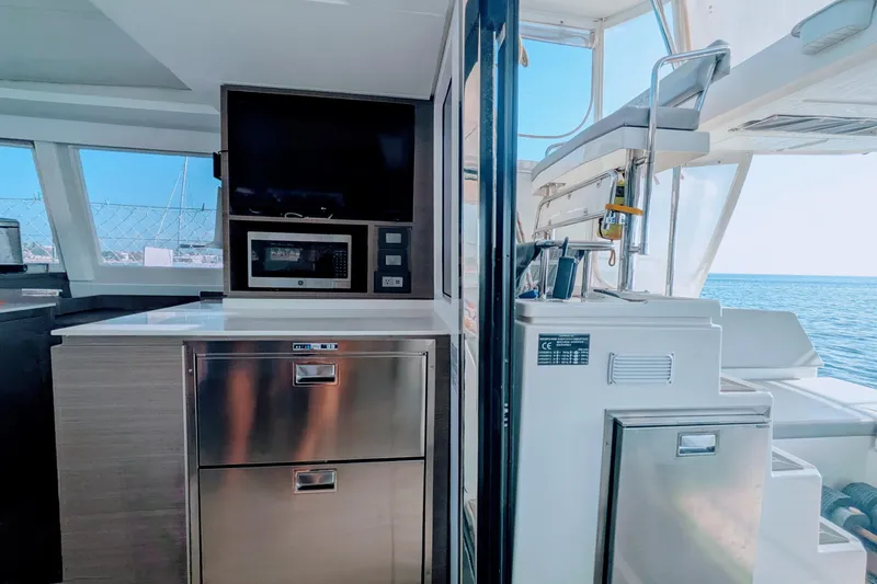 Slide: The Image of Modern kitchen area on 2023 Leopard 42 yacht with ocean view. - 57