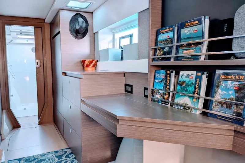 Slide: The Image of Modern Leopard 42 yacht interior with bookshelves, desk, and stylish decor, 2023 model. - 67