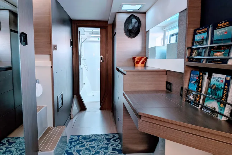 Slide: The Image of Modern interior of 2023 Leopard 42 yacht with desk, bookshelves, and stylish decor. - 68