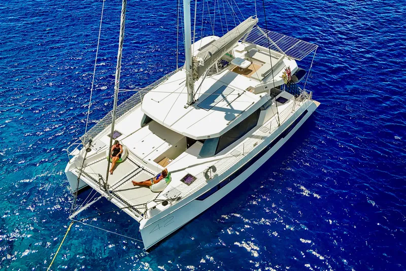 Slide: The Image of 2023 Leopard 42 catamaran sailing on vibrant blue ocean waters. - 7
