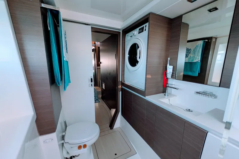 Slide: The Image of Modern bathroom in 2023 Leopard 42 yacht with washer, sink, and toilet. - 74