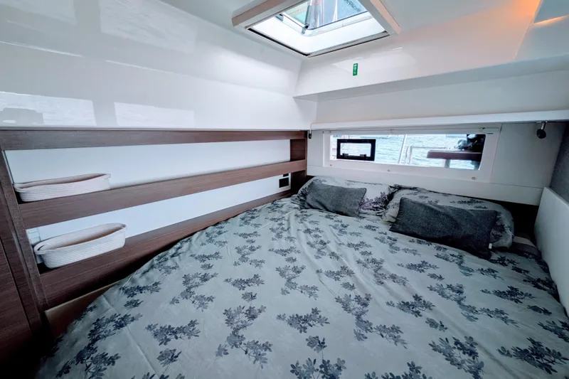 Slide: The Image of Luxurious cabin interior of 2023 Leopard 42 yacht with skylight and elegant bedding. - 77