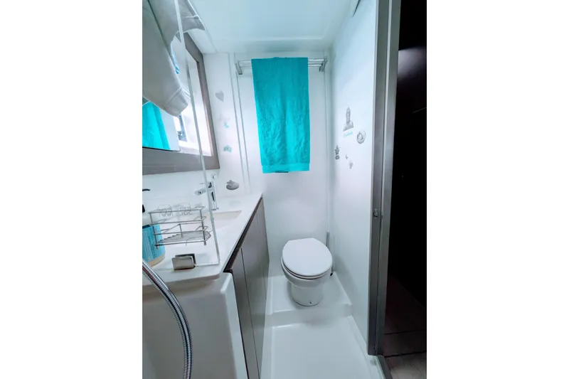 Slide: The Image of Modern bathroom in 2023 Leopard 42 yacht with turquoise accents and sleek fixtures. - 78