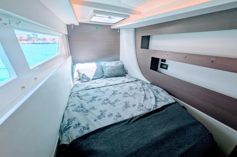 Slide: The Image of Cozy cabin interior of 2023 Leopard 42 yacht with bed and ocean view. - 87