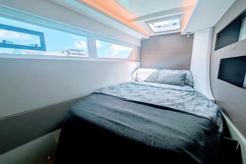 Slide: The Image of Luxurious cabin interior of 2023 Leopard 42 yacht with cozy bed and natural light. - 88