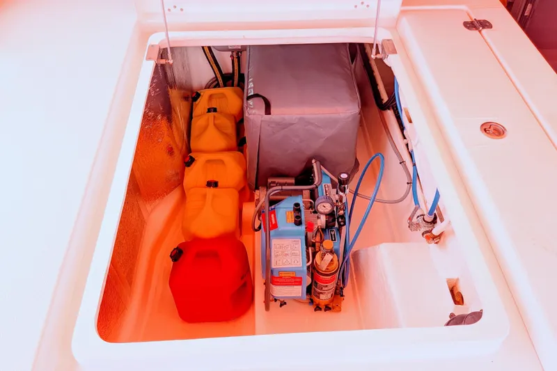 Slide: The Image of Storage compartment on a 2023 Leopard 42 boat with fuel containers and equipment. - 95