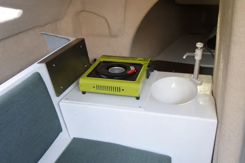 Slide: The Image of Interior of 1999 Corsair F-24 MKII sailboat with stove and sink. - 5