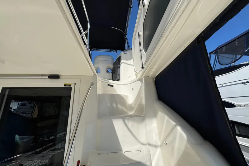 Slide: The Image of 2008 Meridian 391 Sedan yacht interior with stairs and seating area. - 10