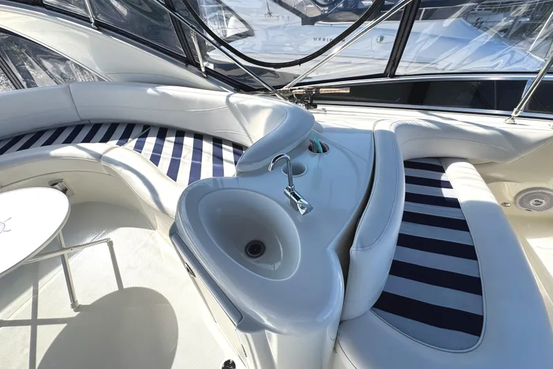 Slide: The Image of Luxurious interior of 2008 Meridian 391 Sedan yacht with striped seating and sink. - 17
