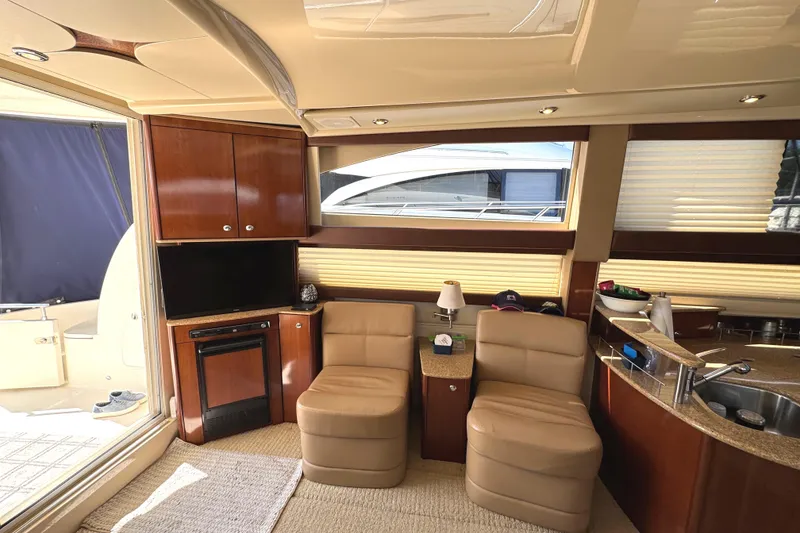 Slide: The Image of Luxurious interior of a 2008 Meridian 391 Sedan yacht with plush seating and modern amenities. - 31