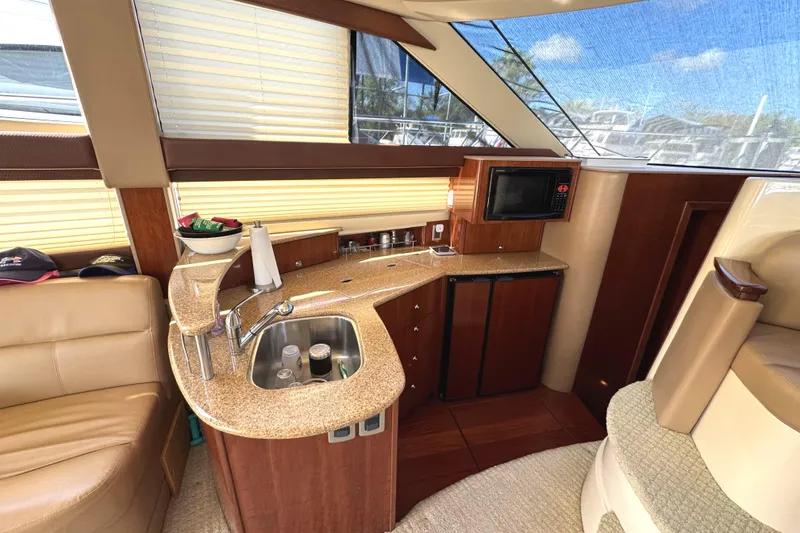 Slide: The Image of Luxurious 2008 Meridian 391 Sedan yacht interior with kitchenette and seating area. - 32