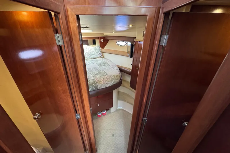 Slide: The Image of Interior cabin of 2008 Meridian 391 Sedan with wood finish and cozy bed. - 35