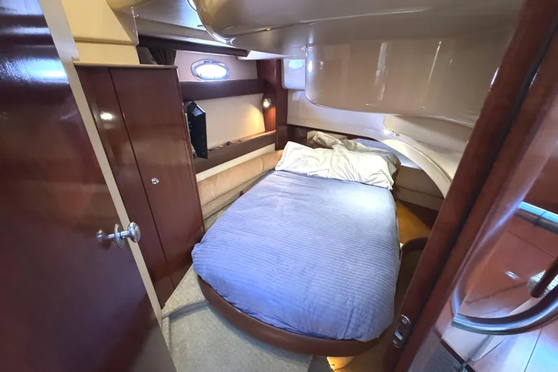 Slide: The Image of Cozy bedroom in 2008 Meridian 391 Sedan yacht with wood accents and porthole window. - 44