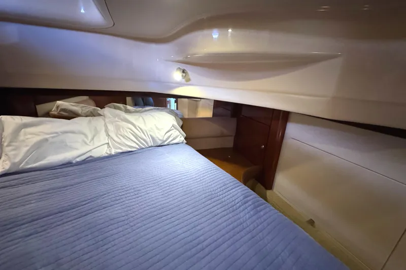 Slide: The Image of Interior cabin of 2008 Meridian 391 Sedan with cozy bed and wooden accents. - 47
