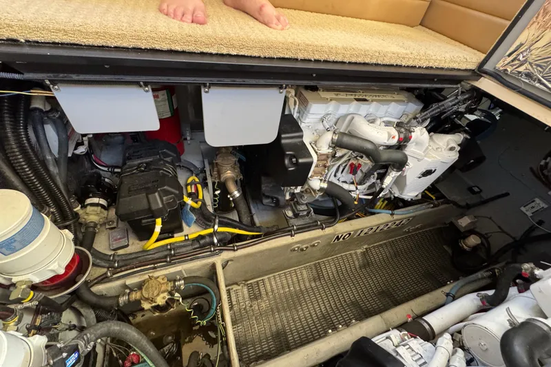 Slide: The Image of Engine compartment of a 2008 Meridian 391 Sedan yacht, showcasing mechanical components and wiring. - 49