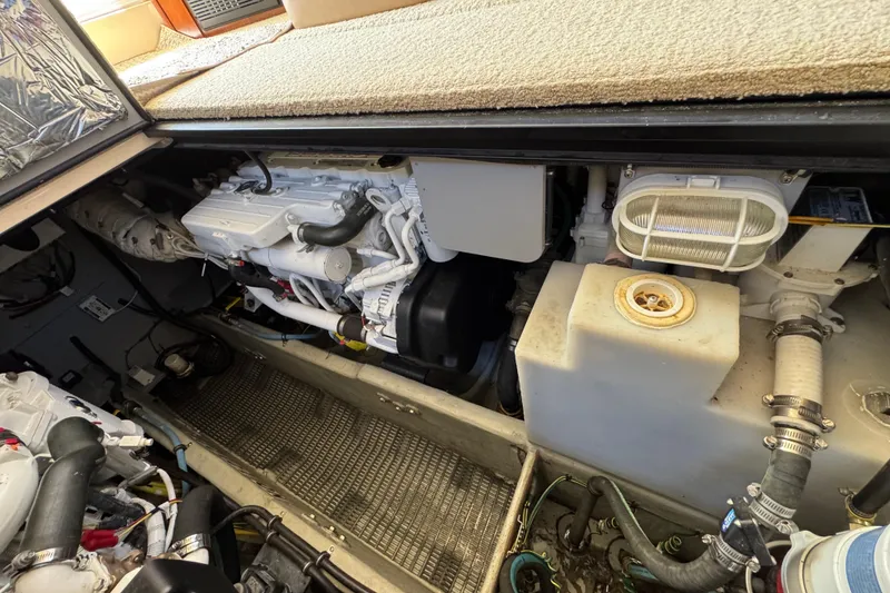 Slide: The Image of Engine compartment of a 2008 Meridian 391 Sedan boat, showcasing mechanical components and systems. - 50
