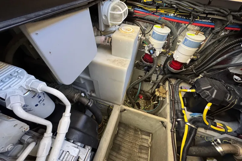 Slide: The Image of Engine compartment of a 2008 Meridian 391 Sedan, showcasing filters and wiring. - 52