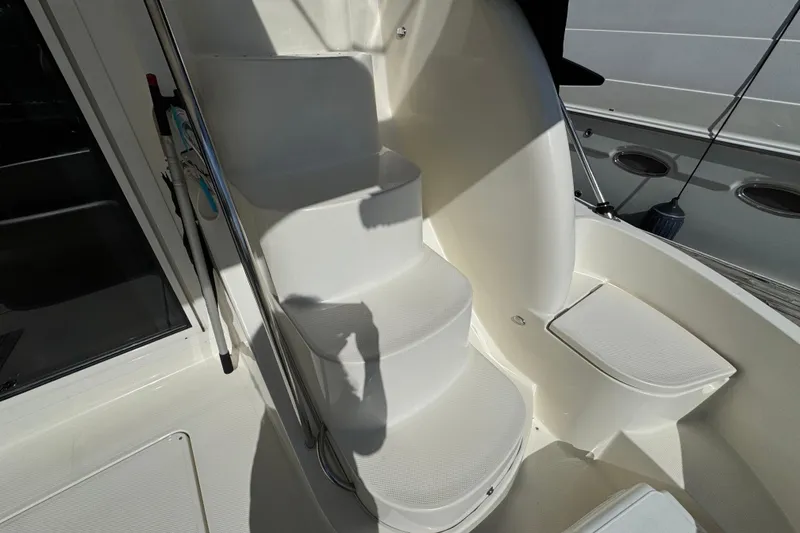 Slide: The Image of Staircase on 2008 Meridian 391 Sedan yacht, featuring sleek white design and modern finish. - 53